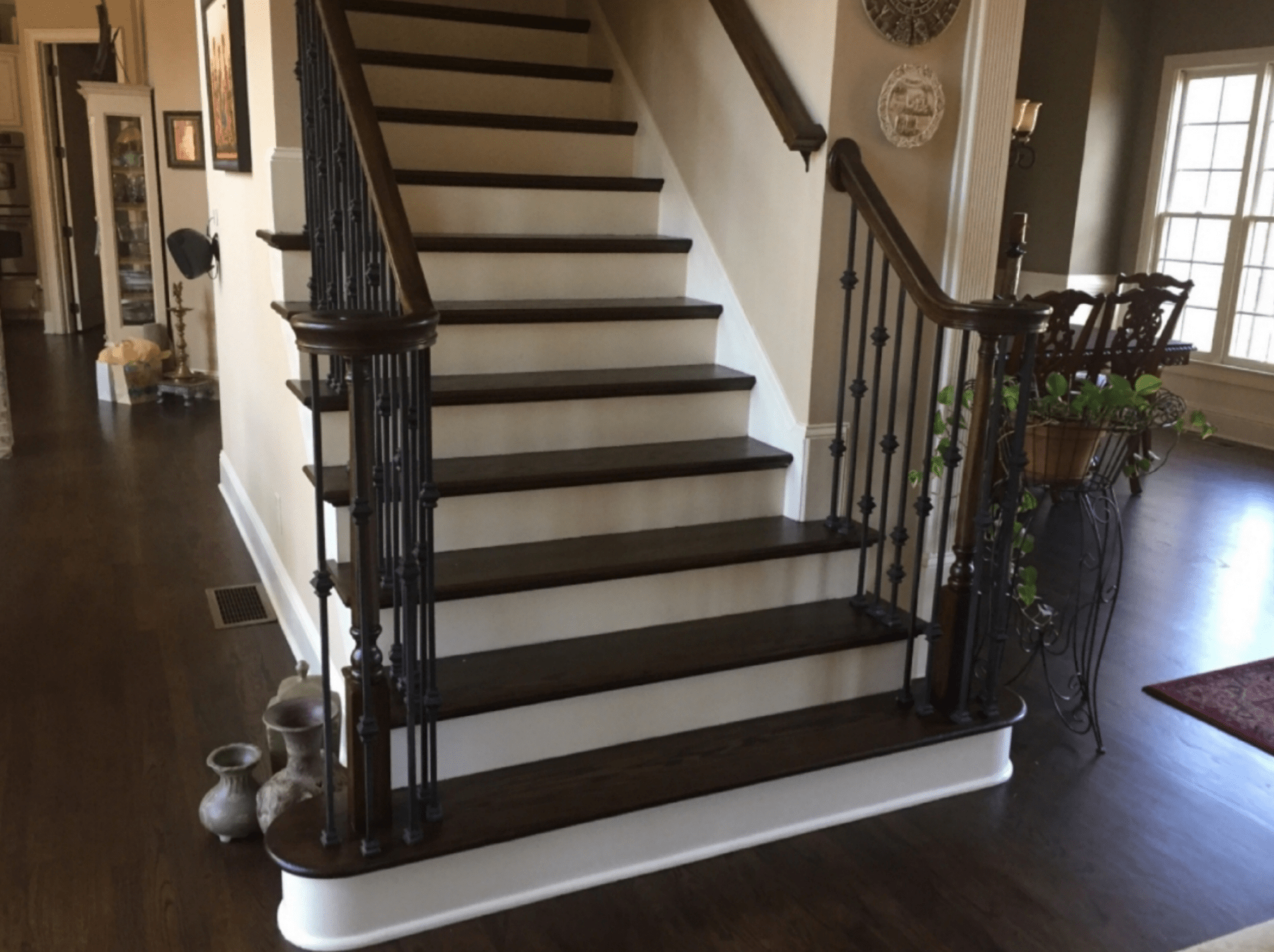 modern hardwood staircase replacement with iron balusters in metro atlanta home